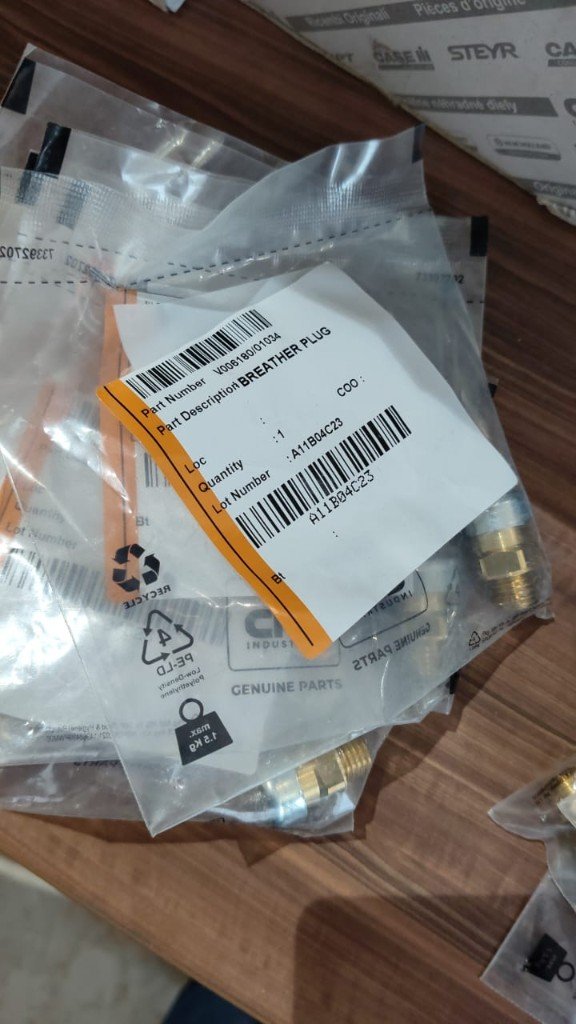 Case CNH cross-reference breather plug V006180/01034 label BREATHER PLUG lot A11B04C23 CNH Industrial Genuine Parts bag — warehouse photo — Pioneer Mitra independent export supplier India