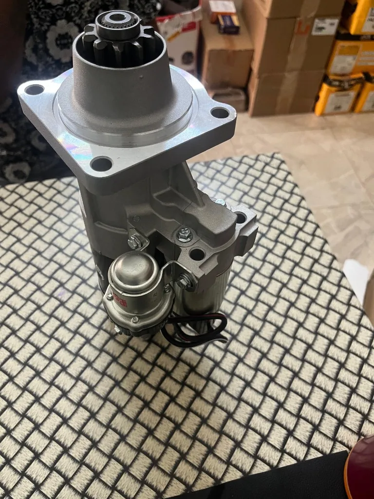 Cummins-compatible 5443655 starter motor 10-tooth pinion mounting flange top view DCEC 1003992961C imported replacement warehouse Pioneer Mitra