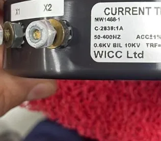 Cummins WICC current transformer terminals X1 X2 brass screws INSPECT OK 07/25 sticker