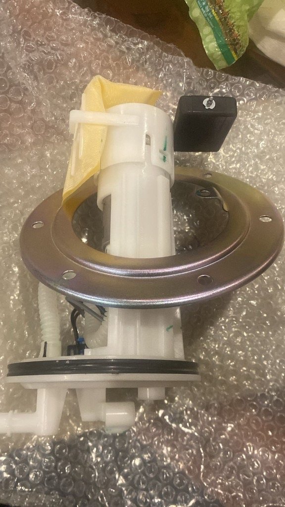 93293749 in-tank fuel pump module side view metal flange plastic body strainer sock