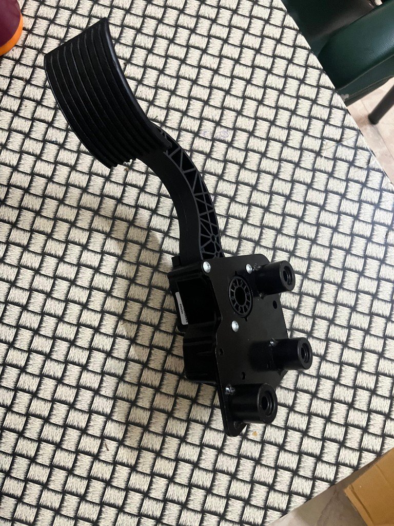 JCB 335/Y5904 complete foot pedal underside mounting bosses and bracket geometry — warehouse photo independent export supplier