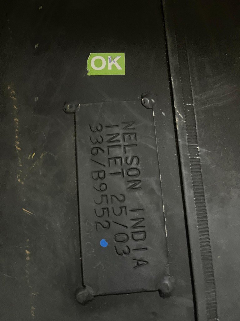 JCB 336/B9552 exhaust silencer nameplate NELSON INDIA INLET 25/03 OK quality sticker close-up — warehouse verification photo Pioneer Mitra