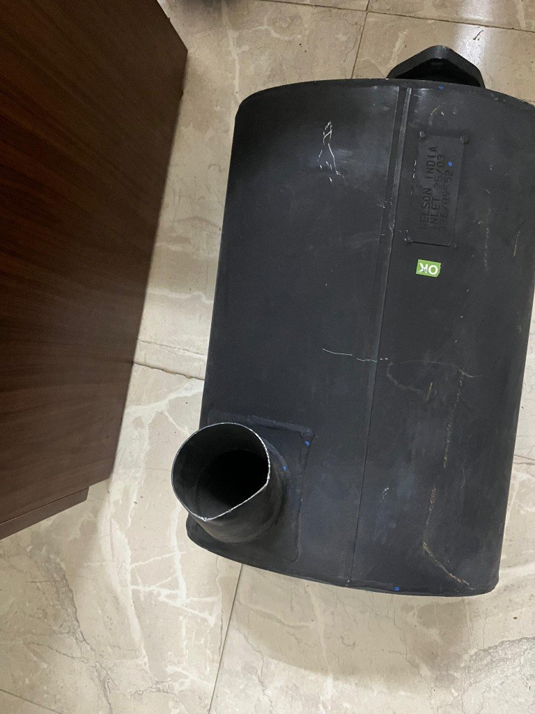 JCB cross-reference exhaust silencer 336/B9552 top view NELSON INDIA nameplate INLET 25/03 OK sticker — warehouse photo — Pioneer Mitra independent export supplier India