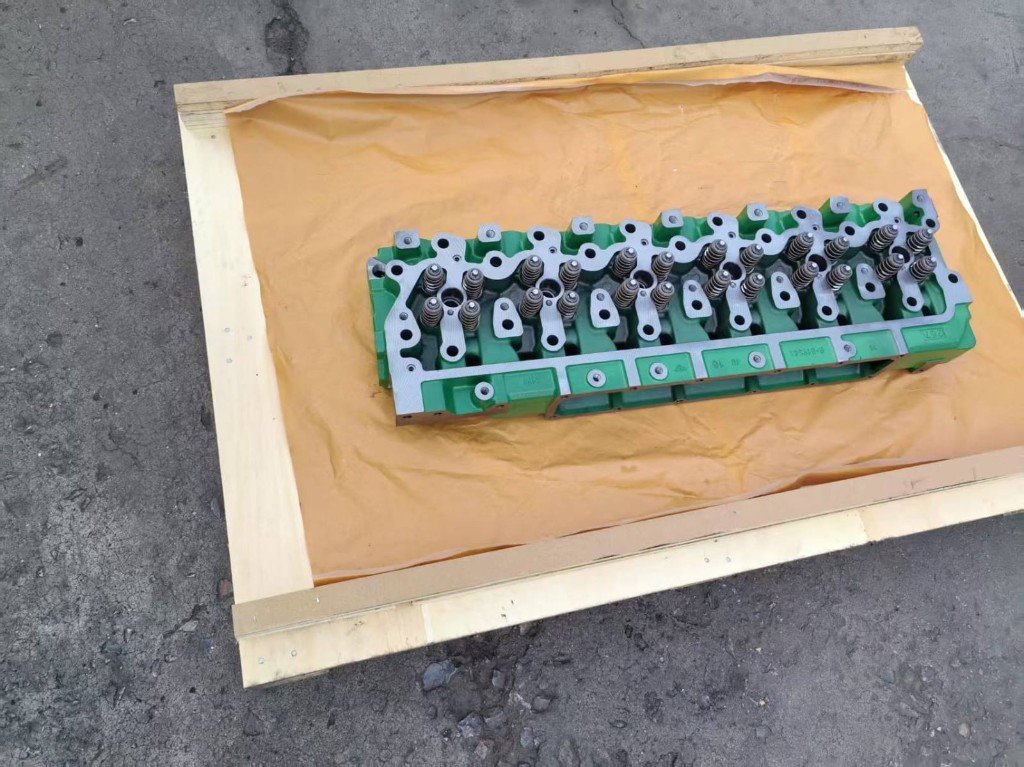 John Deere 6068 cylinder head casting mark R-519541 in export crate — verify against removed unit