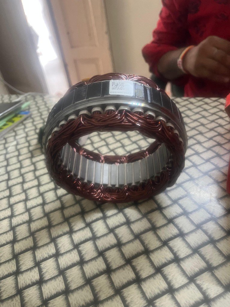 Lucas TVS alternator stator 26218958 SIA140 label 1703260230A2 with copper windings visible — warehouse source photo India export