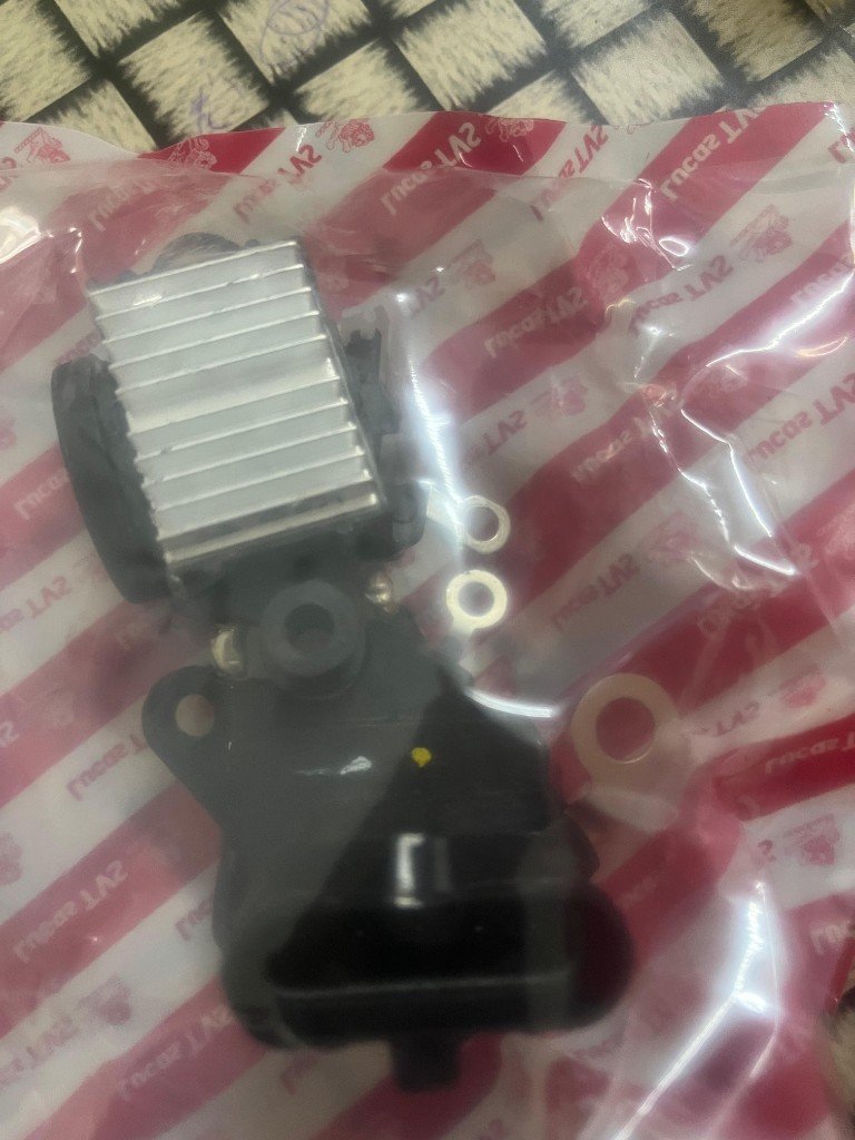 Lucas TVS cross-reference alternator cutout regulator 26218968 heat sink connector in branded Lucas TVS bag — warehouse photo — Pioneer Mitra independent export supplier India
