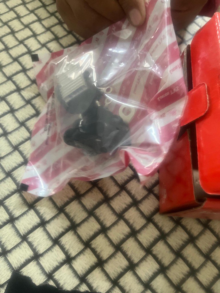 Lucas TVS 26218968 alternator regulator terminals visible with red retail box and branded bag — warehouse photo India export