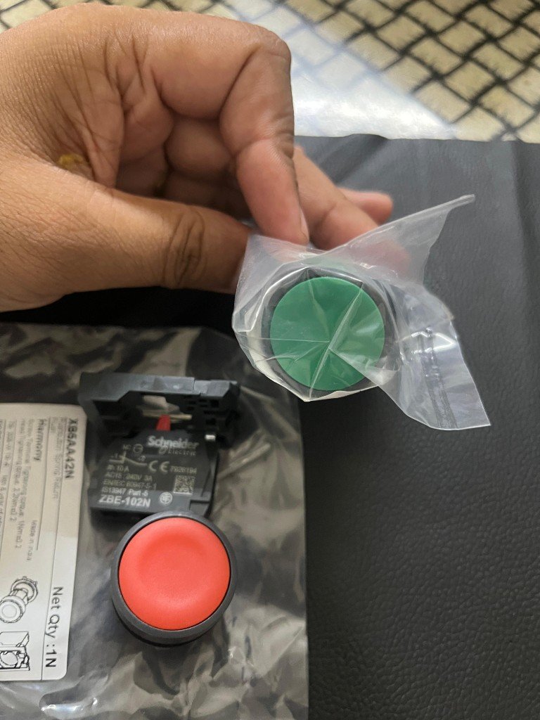Schneider Electric Harmony XB5 series green and red push buttons spring return flush 22mm control station components — warehouse photo Pioneer Mitra export supplier India