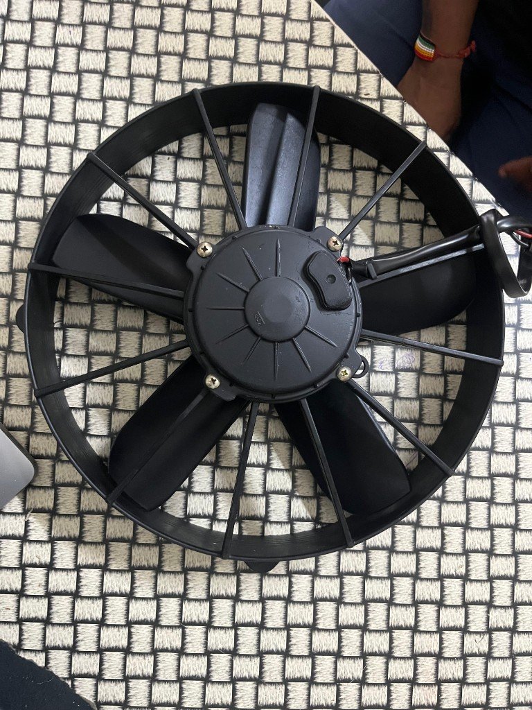 SPAL cooling fan motor rear view wiring exit radial fins — source desk photo India export