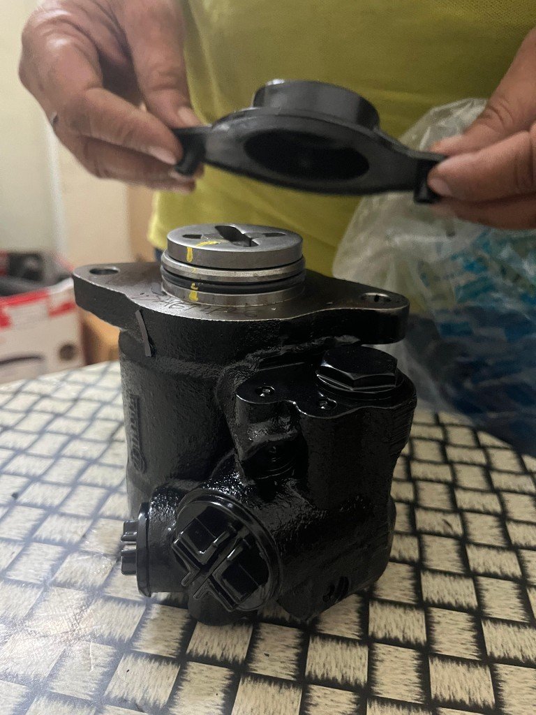 ZF 7673955810 steering pump body mounting flange yellow QC inspection mark — warehouse photo India export