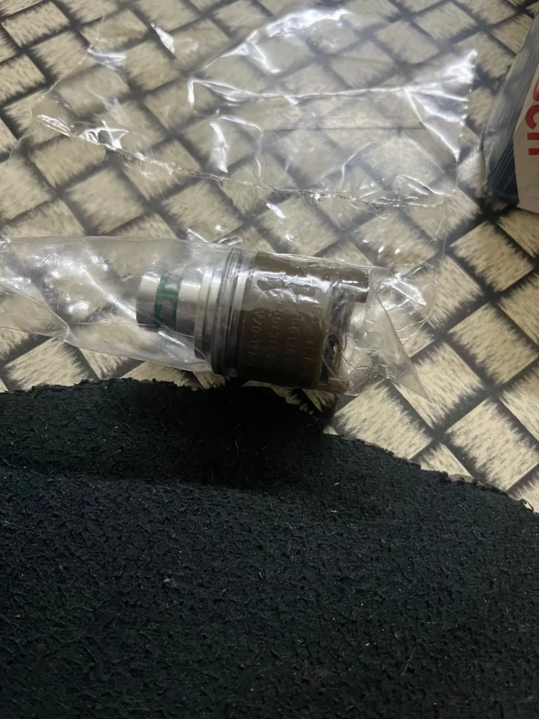 Bosch 0260120025 24V compressed air solenoid valve close-up in sealed bag — markings 0 260 120 025 warehouse photo