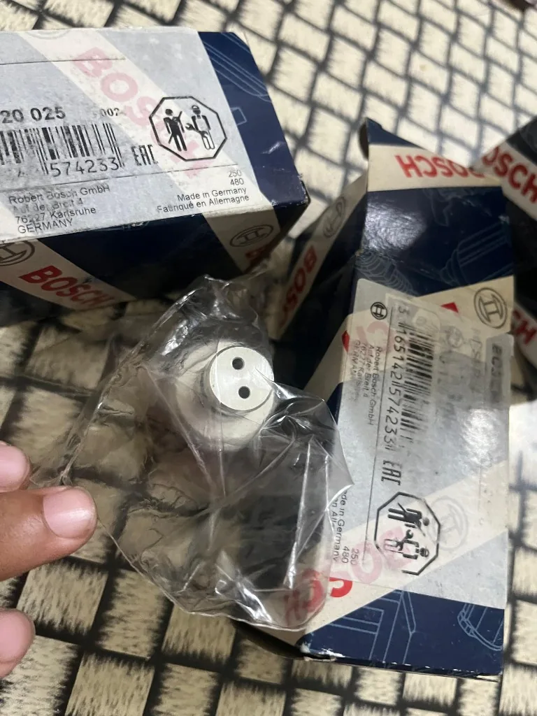 Bosch 0260120025 compressed air solenoid valve top view in sealed plastic bag — 24V marking warehouse photo