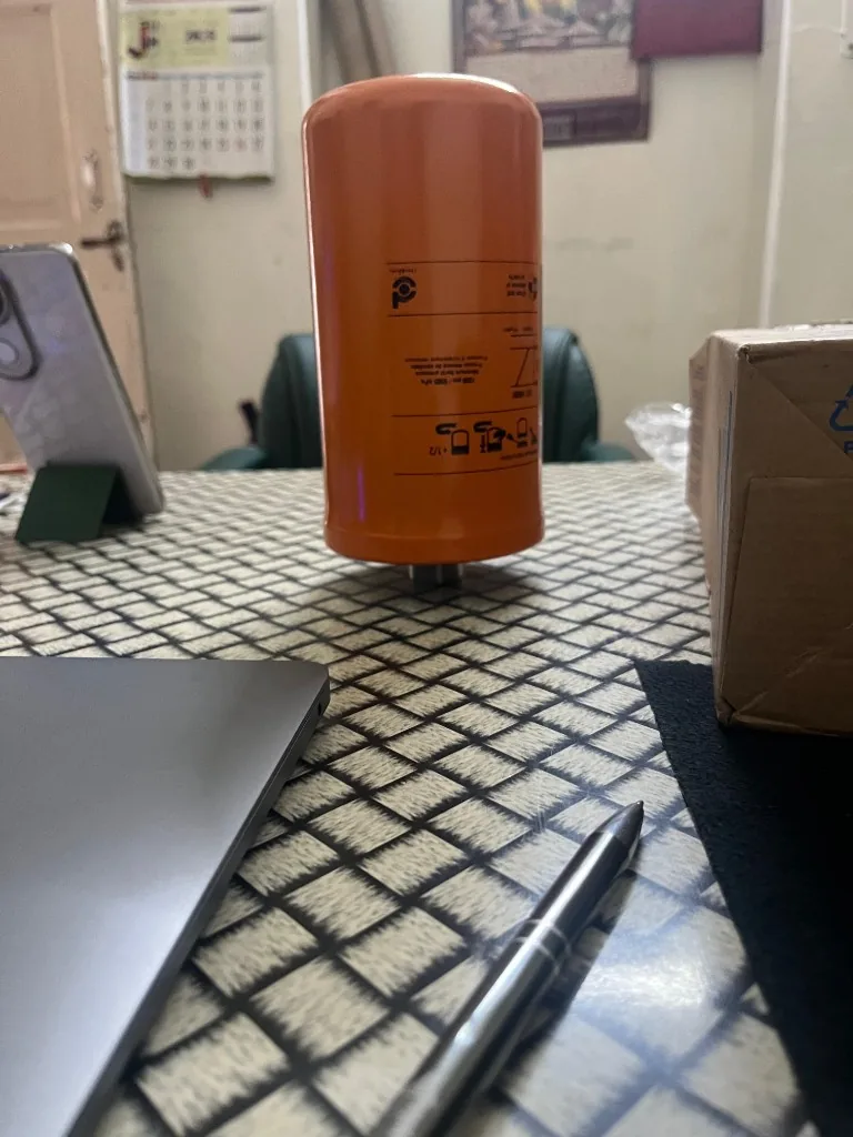 Donaldson Duramax orange hydraulic spin-on filter upright on desk — P550416 cross-reference warehouse stock photo