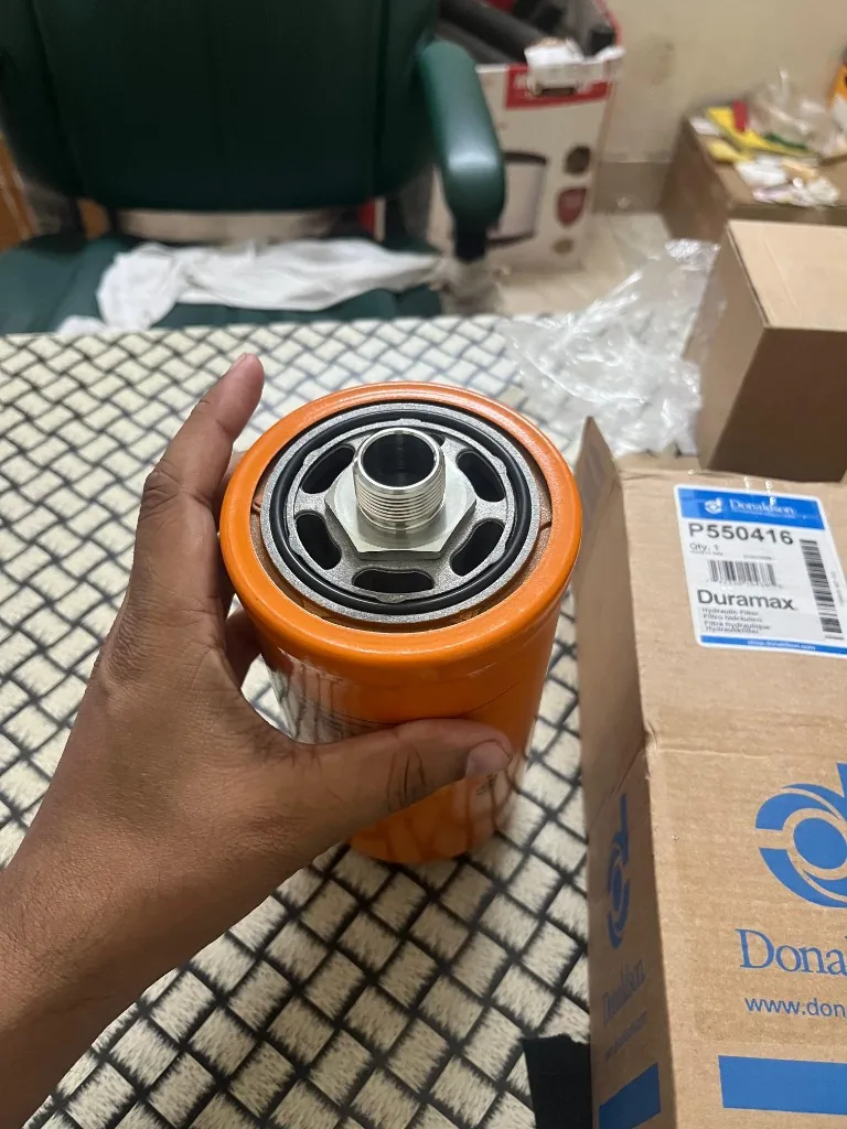 Donaldson P550416 spin-on filter top view — threaded base and gasket face orange Duramax canister warehouse photo
