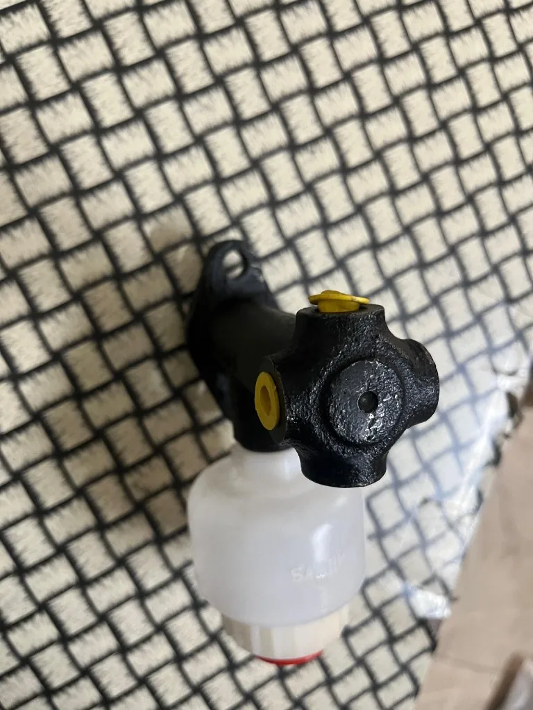 Forklift hydraulic brake master cylinder assembly — warehouse front view