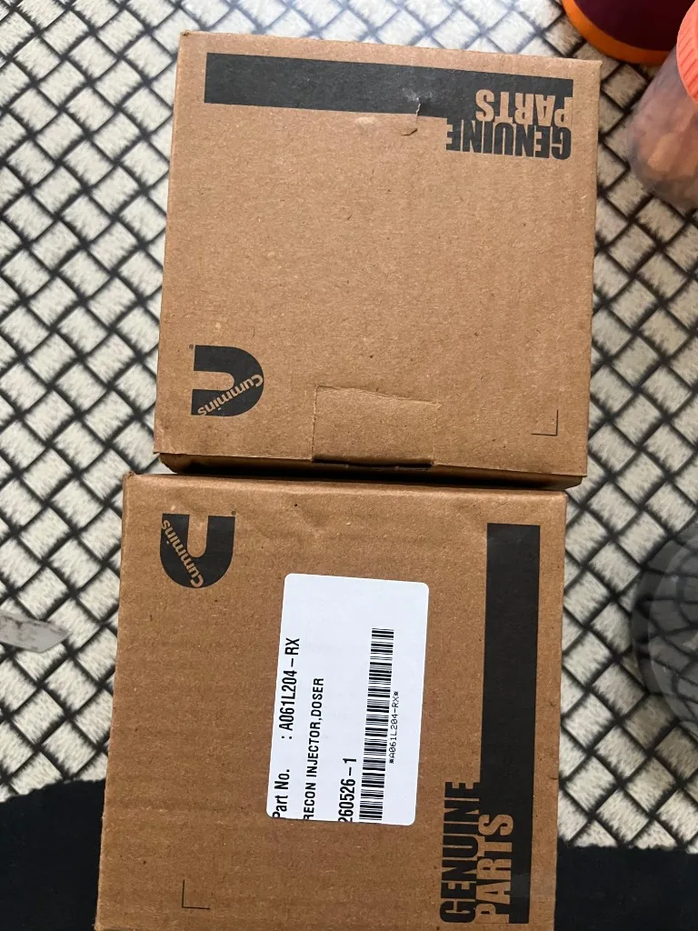 Manufacturer Genuine Parts packaging visible in warehouse photo — reference only