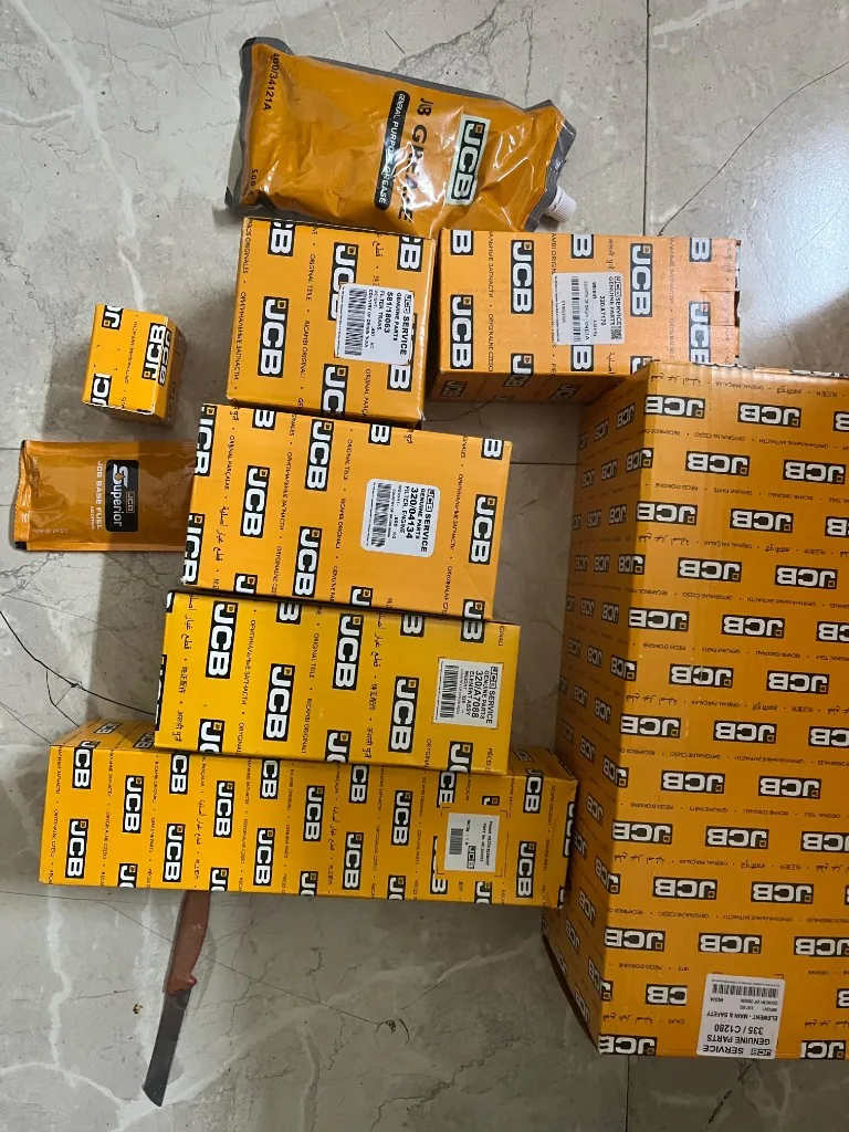 JCB 3DX filter kit 400/N7762 all ten components laid out — 335/C1280 320/A7170 320/04134 warehouse photo