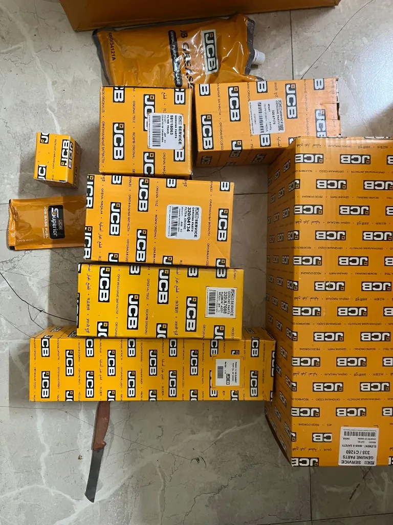 JCB 3DX 1000 hour filter kit components close layout — yellow JCB Service Genuine Parts boxes