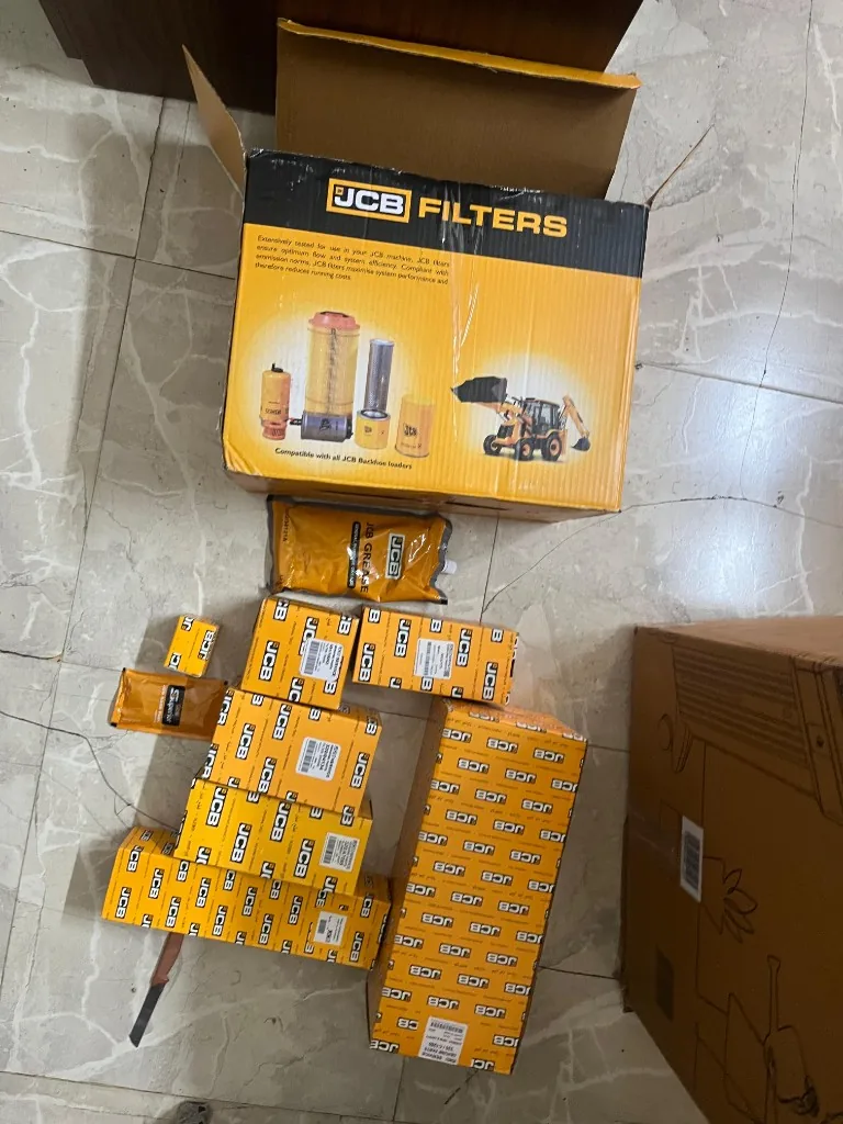 JCB FILTER KIT 3DX open main box with individual Genuine Parts boxes and carry bag warehouse photo