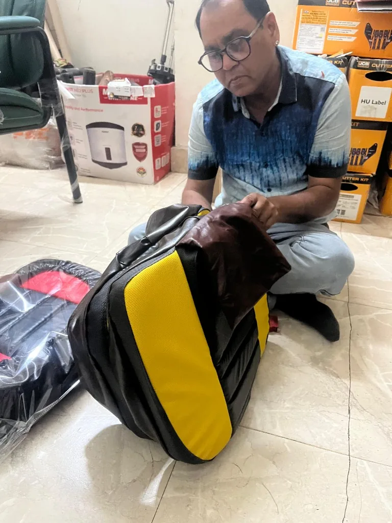 PU tractor seat cushion inspection in warehouse — padded ribs and mesh backing export verification photo