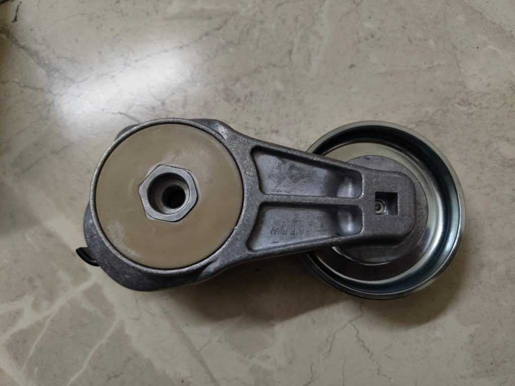 CNH 504315785 belt tensioner pulley and spring arm actual product photo